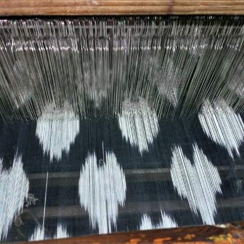 closeup of ikat weaving on loom